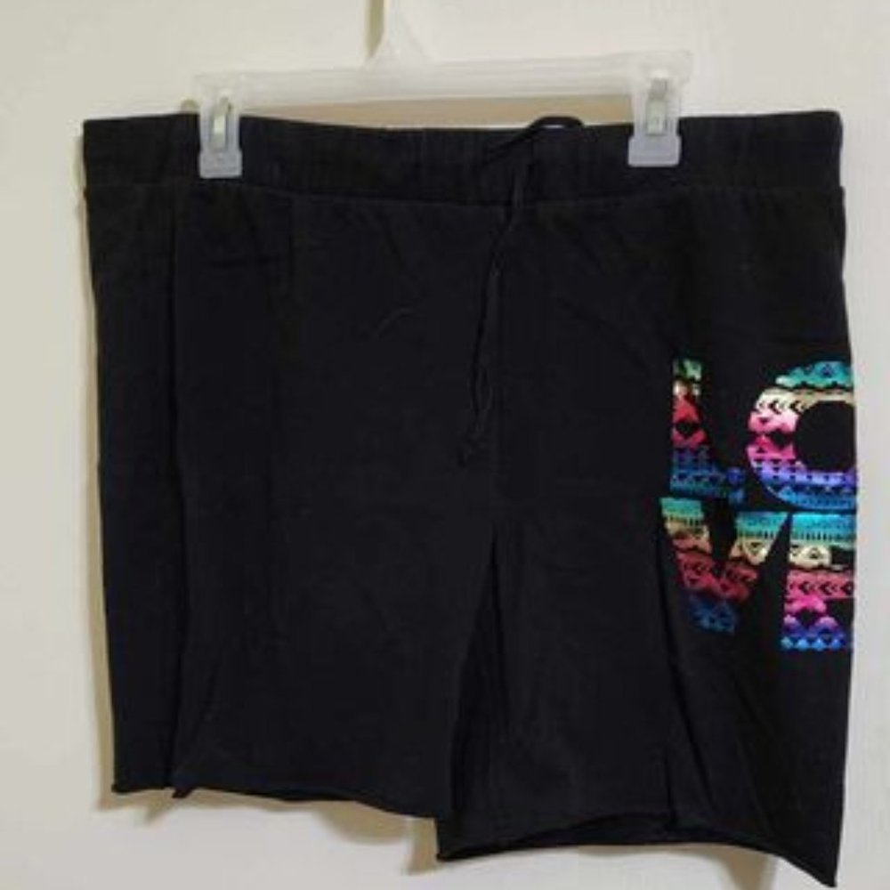 Black shorts with metallic LOVE on left leg